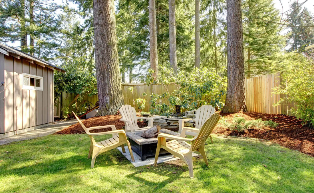 Light beige Adirondack chairs around backyard fire pit