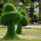 Lush green topiary mushrooms sculpted from dense textured grass in Topiary Moss