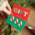 Red and green Primark gift cards with festive holiday designs